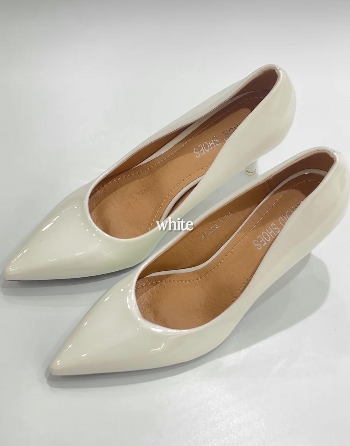 Ivory patent pointed-toe pumps from the inaugural Lonkol collection